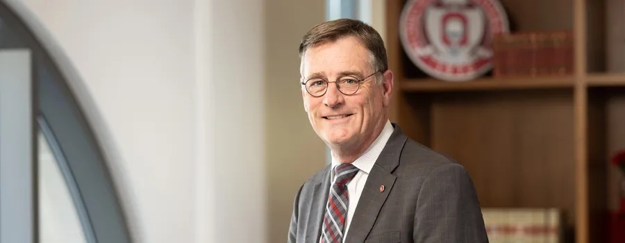 John Horack in a gray suit with a red and gray tie