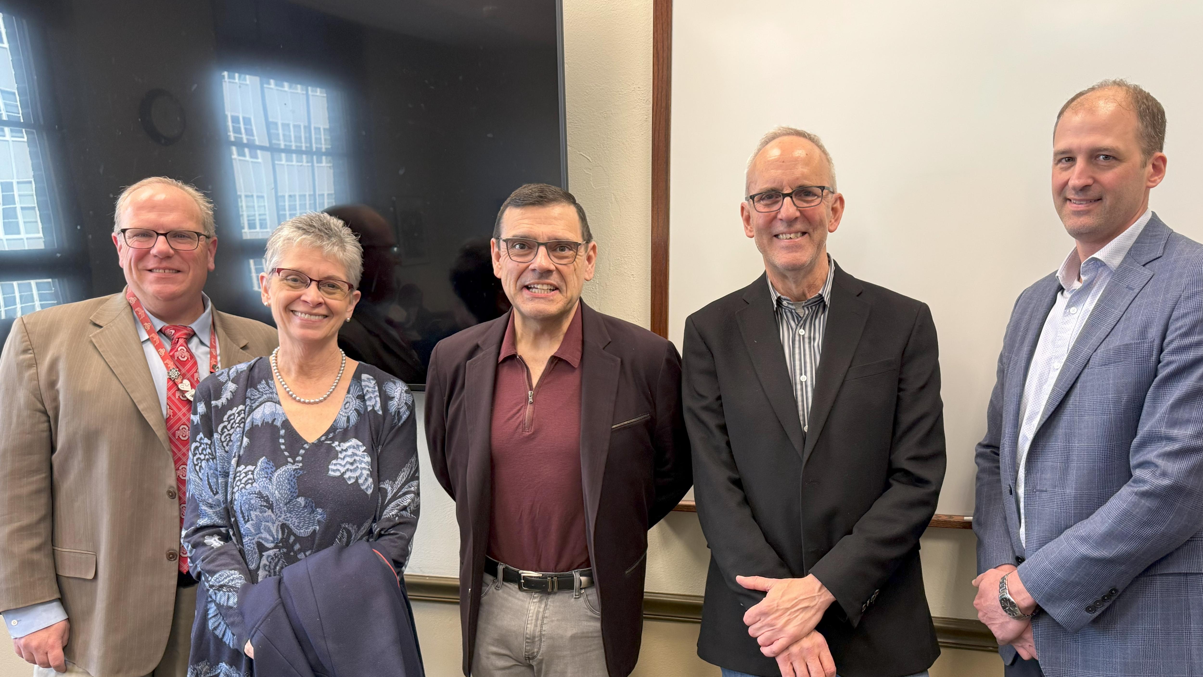 Michael A. Neblo with research and department leadership