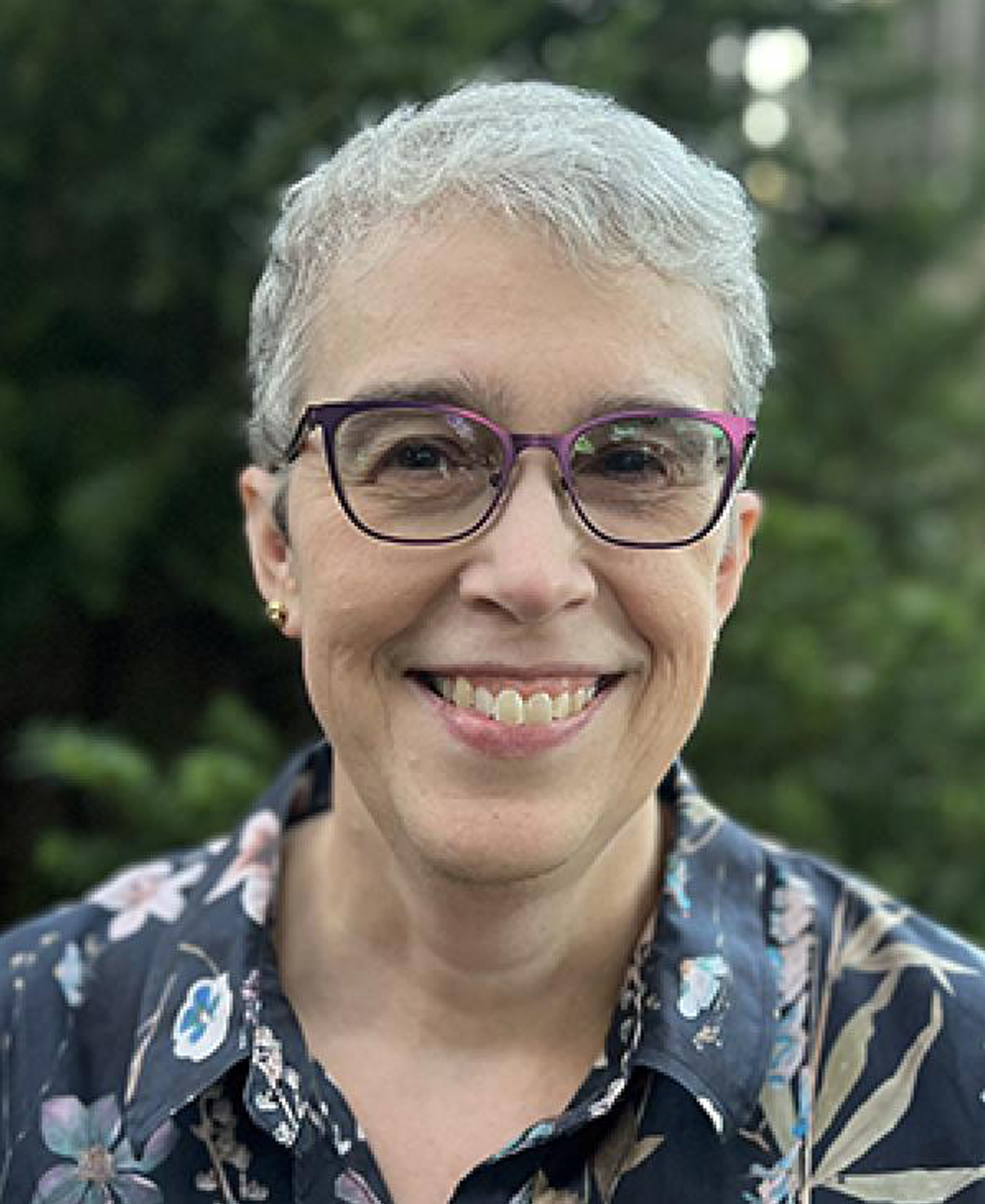 Flosler-Lussier outside with trees in the background