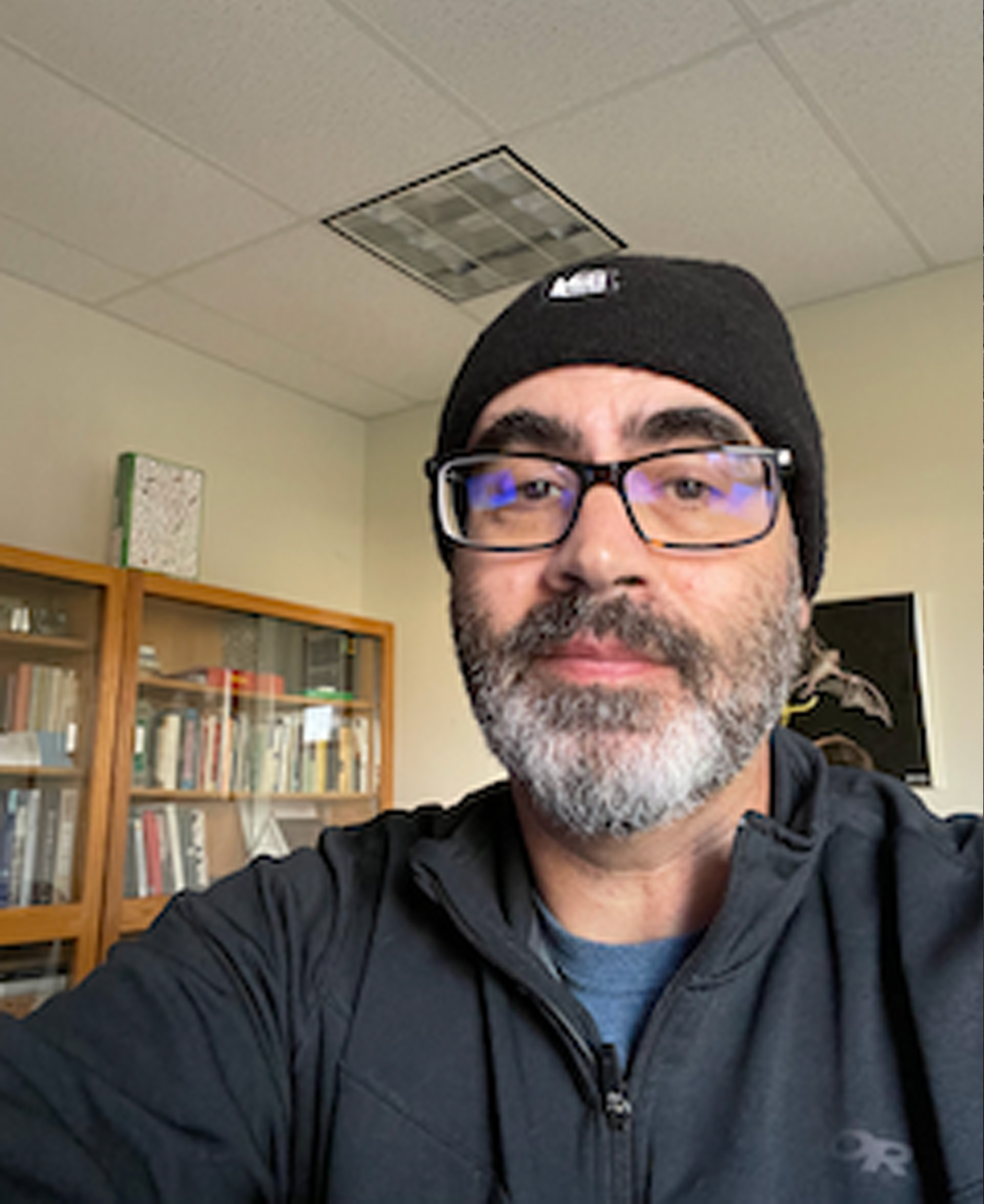 Bryan Carstens in office with hat