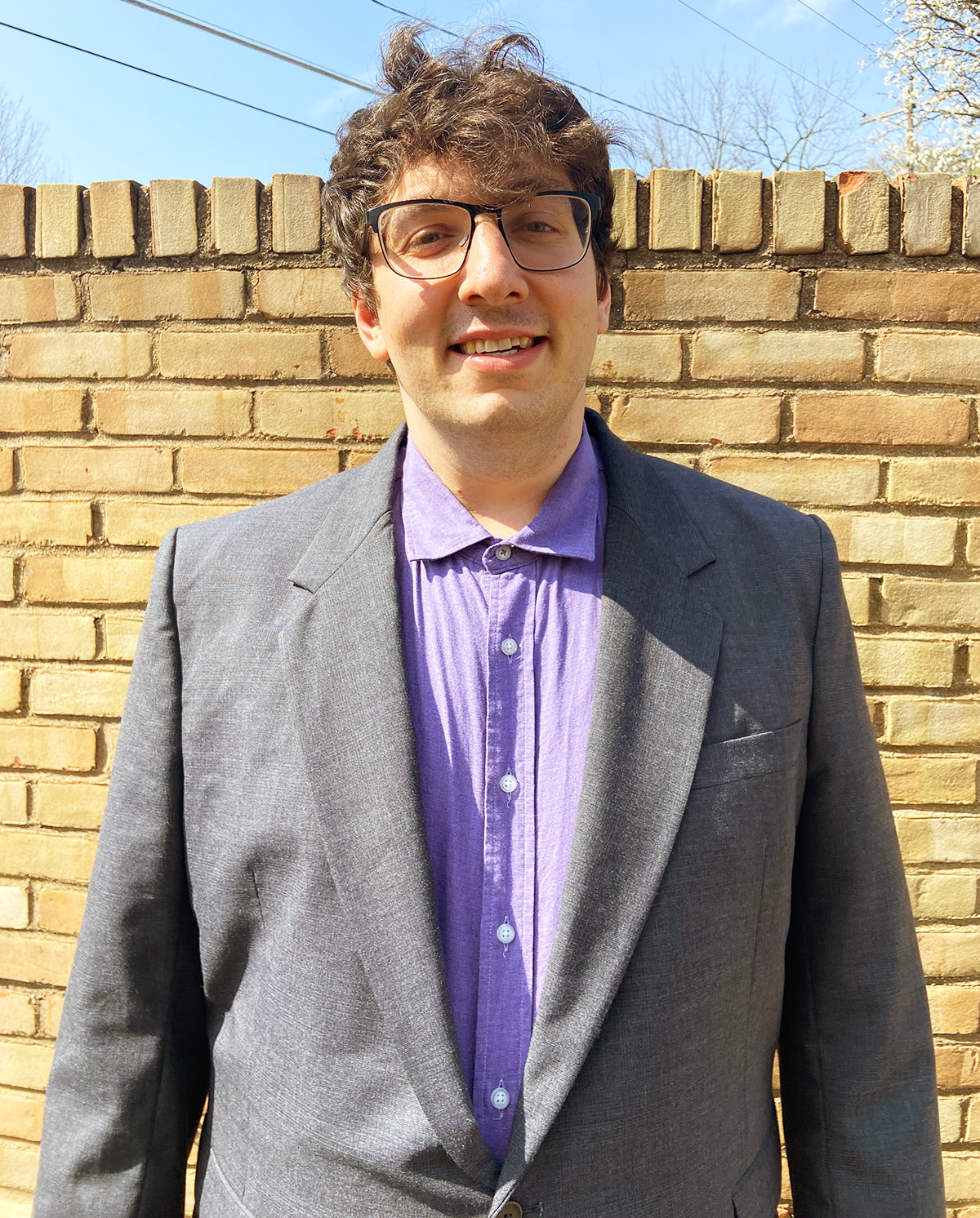 Matthew Steinhauer in front of a brick wall