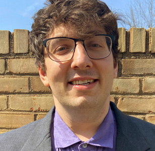 Matthew Steinhauer in front of a brick wall
