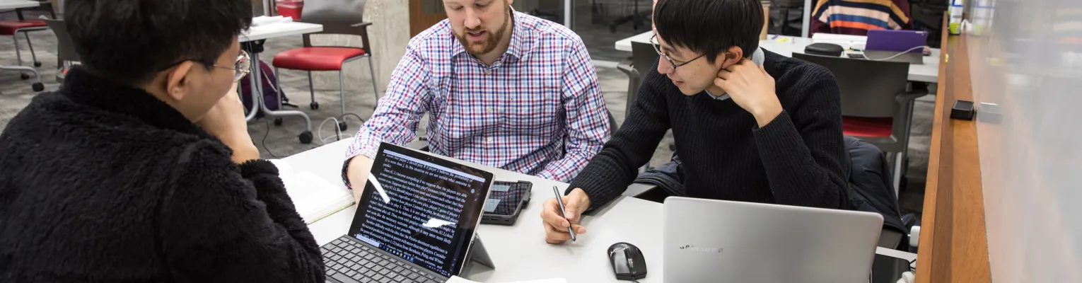 group of researchers working at computers