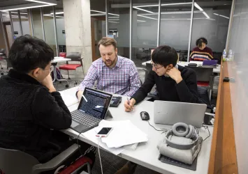 group of researchers working at computers