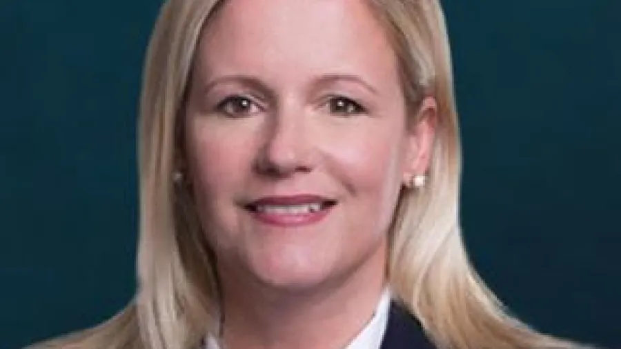 Becky Kaufman in a white shirt and black jacket