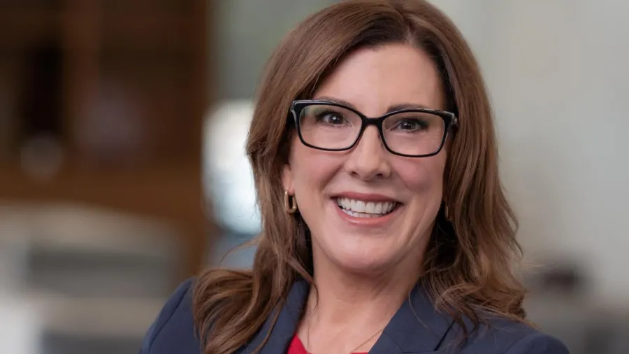 Colleen Gilger in gray suit