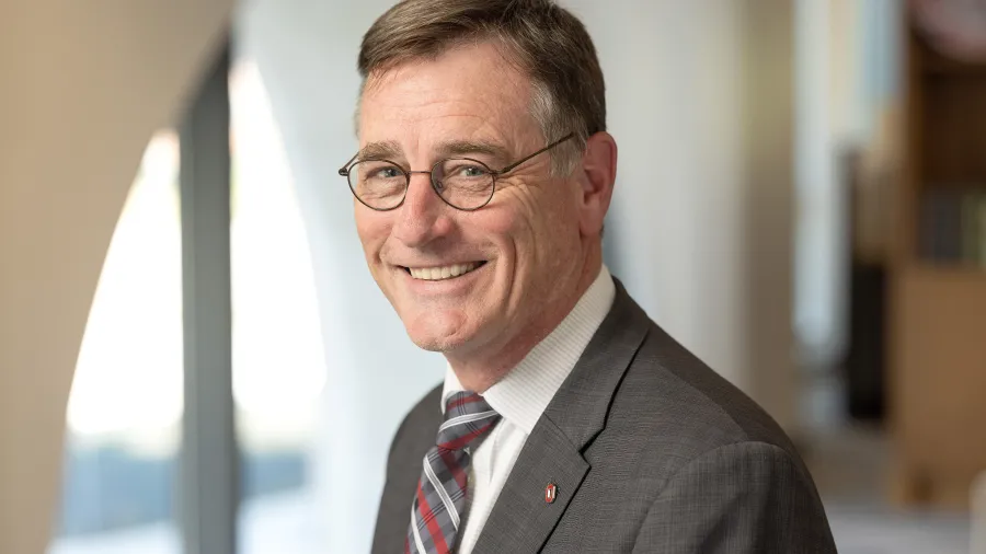 John Horack in a gray suit coat and red and gray tie
