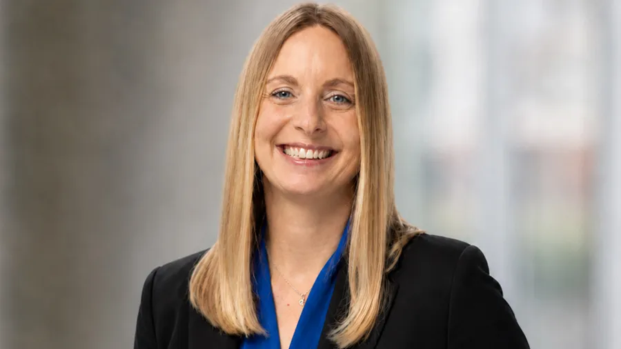 Heather Sever in a blue shirt and black blazer