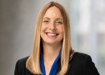 Heather Sever in a blue shirt and black blazer