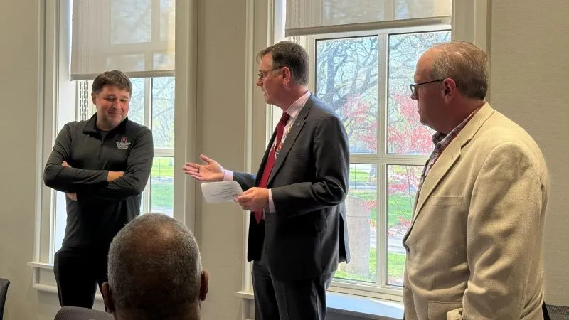 John Horack and Loren Wold present Chris Jaroniec with his award. 
