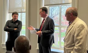 John Horack and Loren Wold present Chris Jaroniec with his award. 