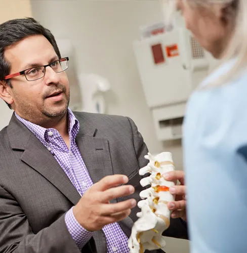 A physician discussing spine with a patient