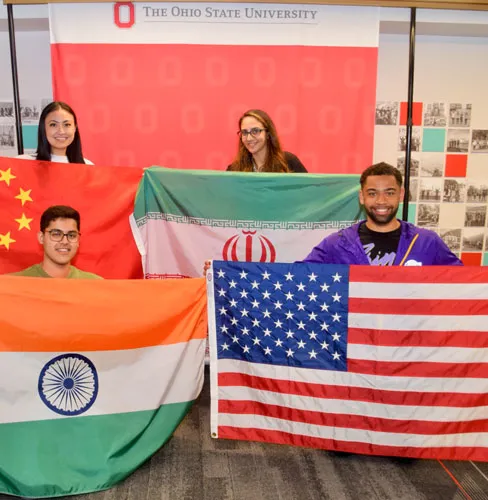 people holding the flags from different countries