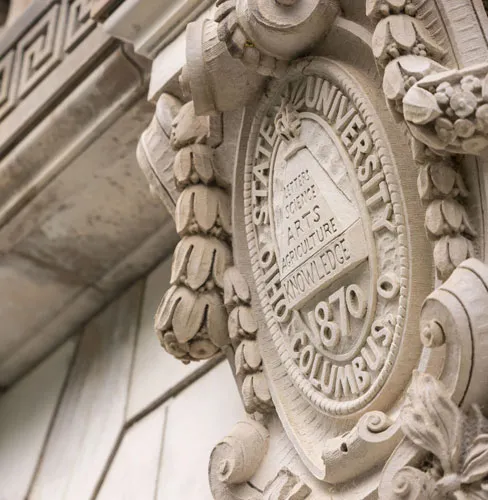 Architectural detail of the Ohio State University seal etched into the limestone on the east facade of the library.