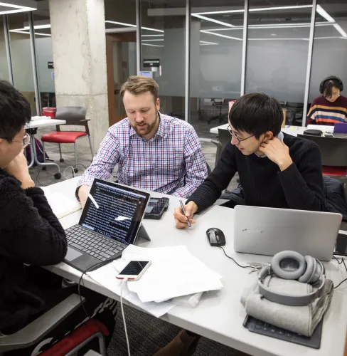 group of researchers working at computers