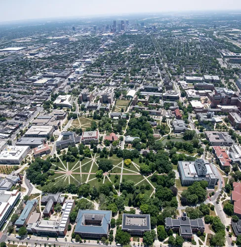 Aerial view of Ohio State campus with the downtown Columbus skyline in the background