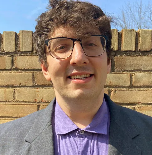 Matthew Steinhauer in front of a brick wall