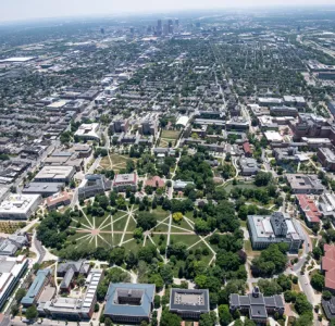 Aerial view of Ohio State campus with the downtown Columbus skyline in the background