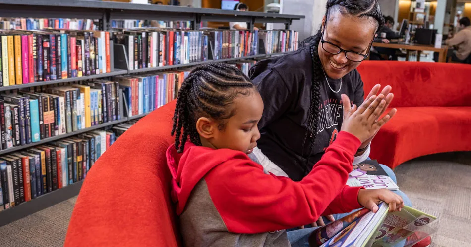 Mother and children in Family Zone at the Thompson Library