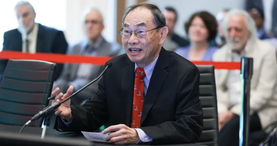 L.S. Fan explaining his work to the board of trustees