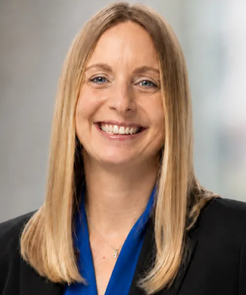 Heather Sever in a blue shirt and black blazer