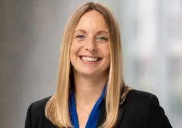 Heather Sever in a blue shirt and black blazer